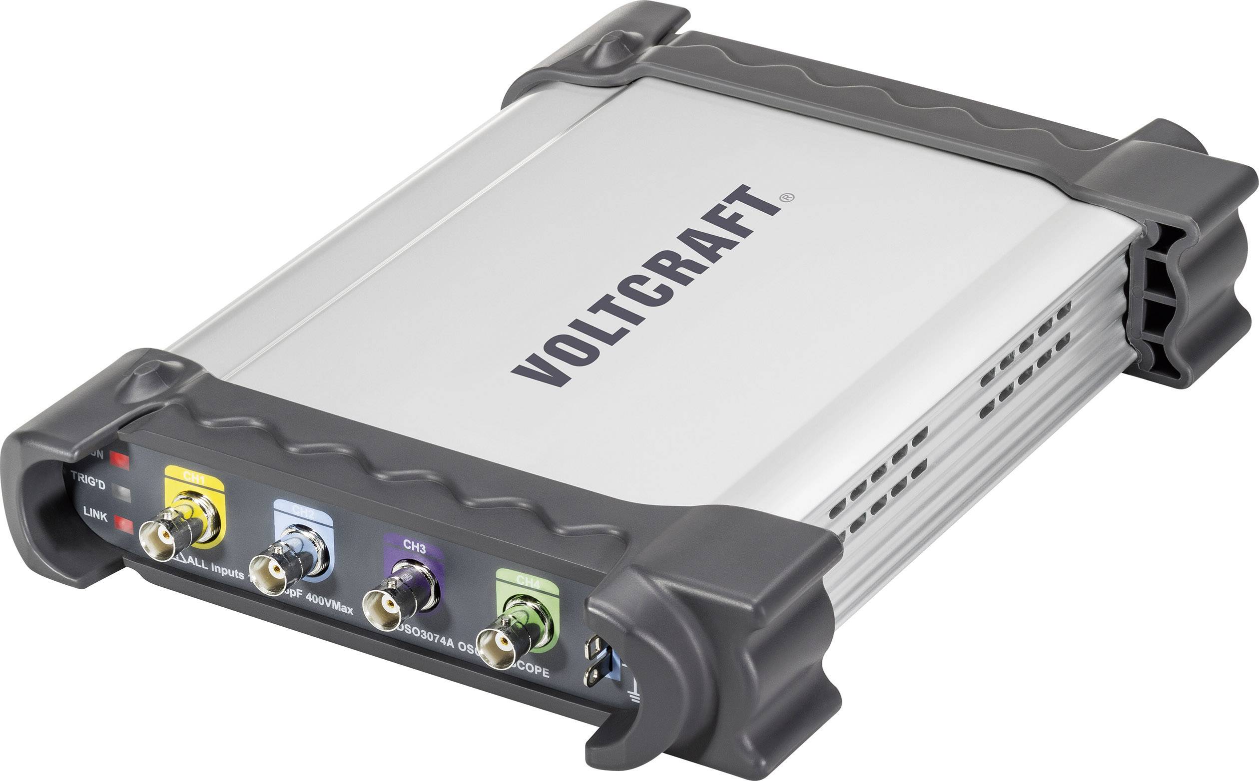 A metallic measuring device by VOLTCRAFT with four coloured connectors: yellow, blue, red, and black. Robust with grey corner protectors.