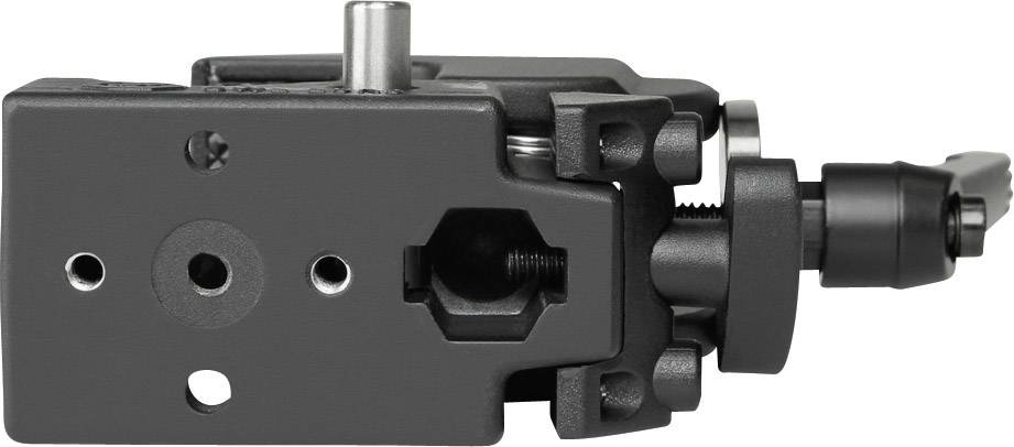 A black mechanical component with various openings and screws. It appears to be part of a larger device or system.