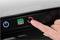 A hand presses a button on a dishwasher control panel. Symbols indicate Start, Auto Mode, Cold Wash Setting, and Reset.