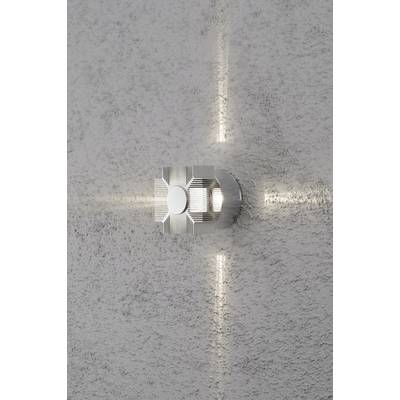 Wall-mounted lamp, casting light in four directions, with a metallic design, providing stylish illumination to a modern space.