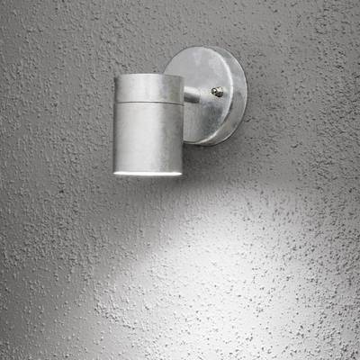 Wall light made of metal in an industrial design, casting bright light onto a grey, textured wall.