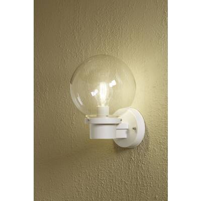 Wall light with a round, clear glass shade and visible light bulb mounted on a beige wall.