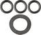 Four black sealing rings, three small ones positioned at the top and one large one centrally placed at the bottom, on a white background.