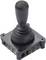 A black joystick with a round handle mounted on a square base.