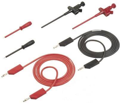 Several electrical test leads and clips, black and red, for electronic devices.