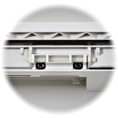 A white plastic mechanism with screws, possibly part of a furniture hinge or sliding system.