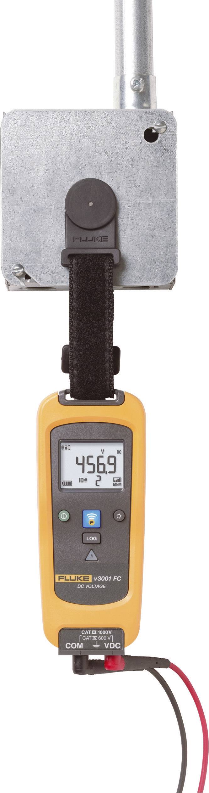 A digital measuring device records 456.9 units. It is connected to an electrical component that is mounted on a metal fixing.
