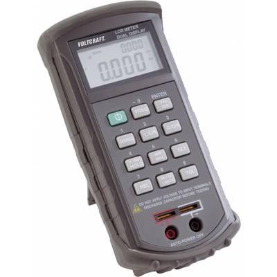 Portable LCR measuring device with two displays, showing zero measurement. Buttons for function selection. Note on voltage avoidance.