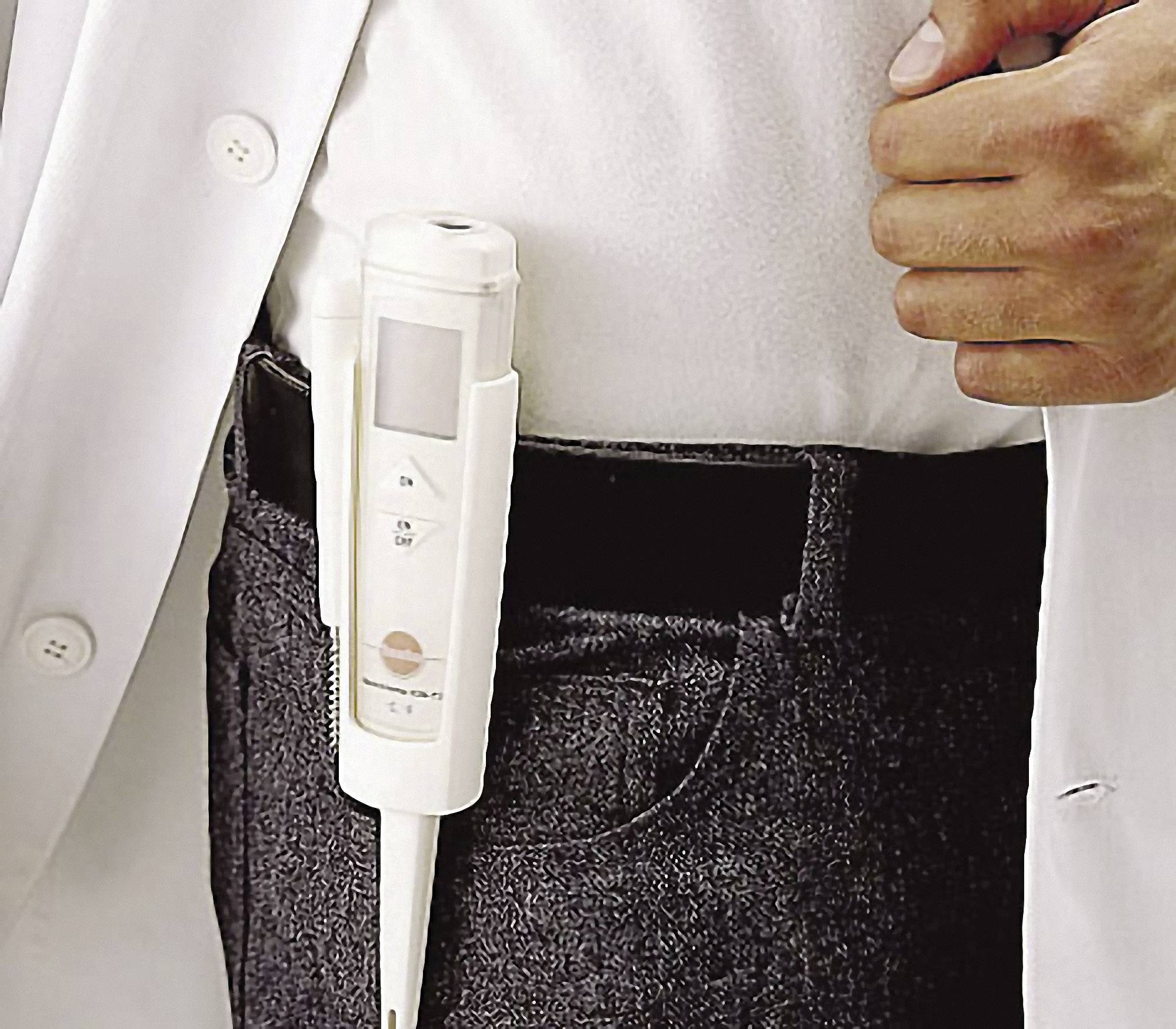 A doctor in a white coat is carrying an electronic measuring device in their trouser pocket.