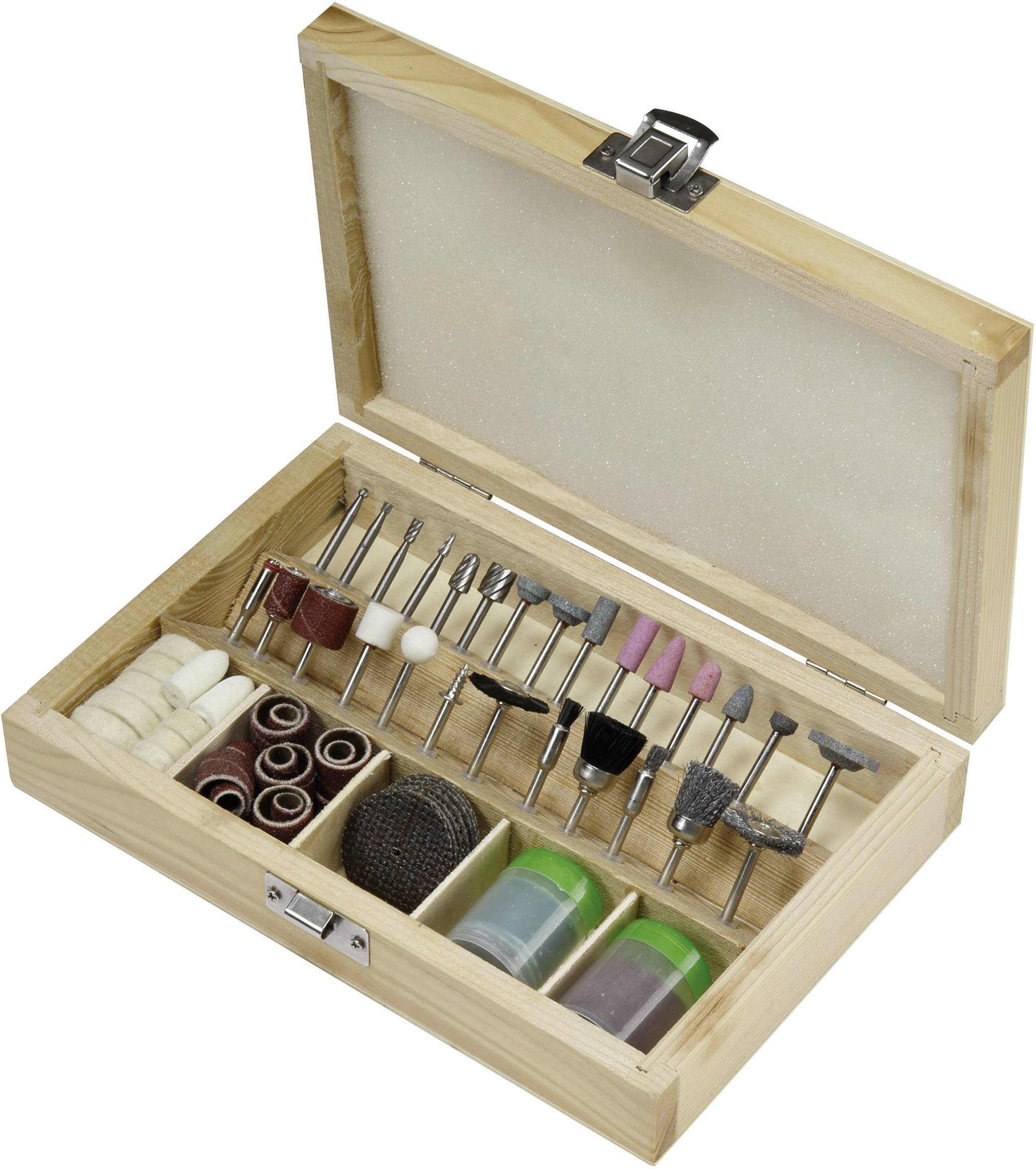 An open wooden box containing various rotating tool attachments and grinding discs in different shapes and sizes.