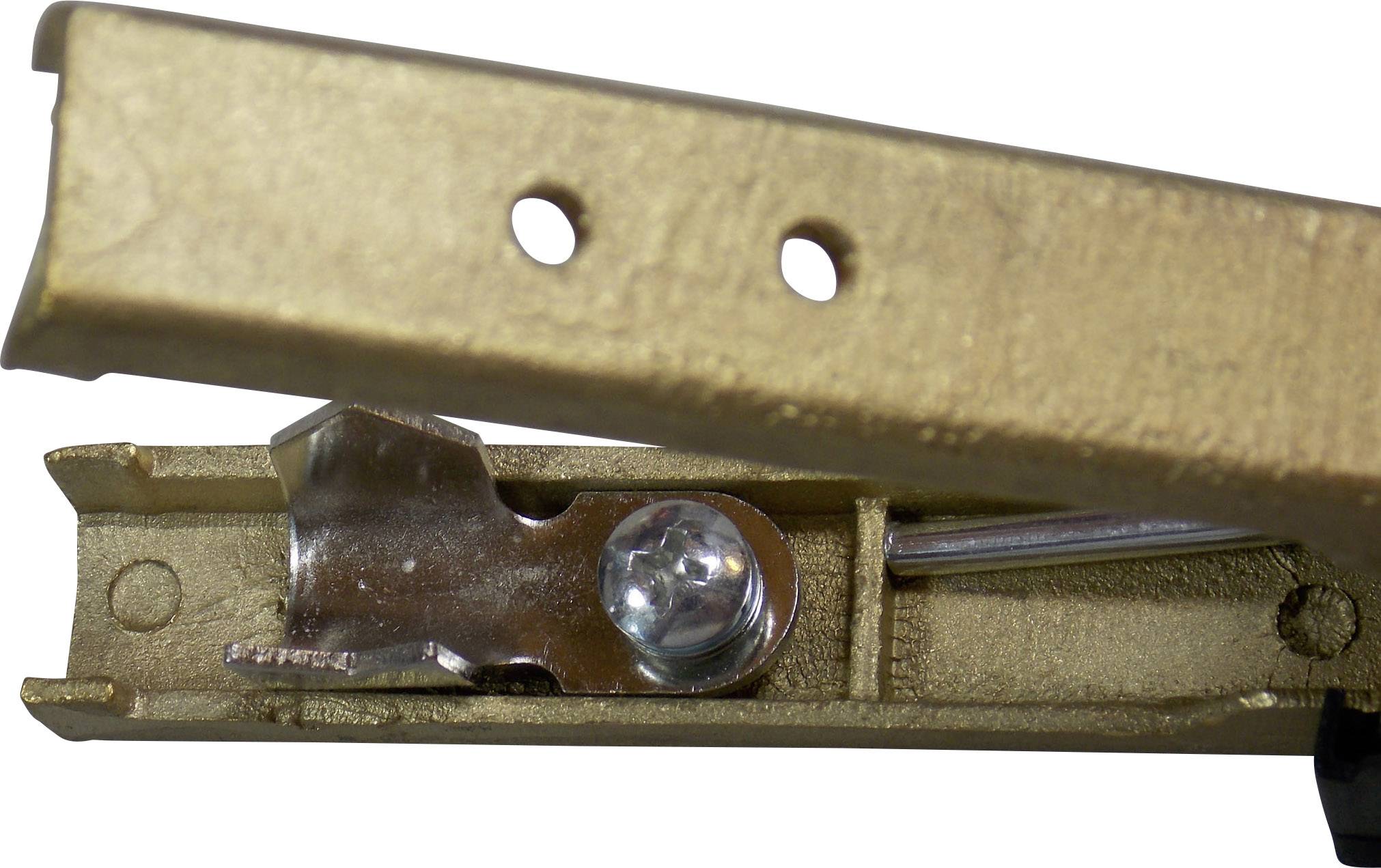 Close-up of a golden metal part with two holes and a silver hinge mechanism.