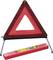 Red warning triangle on metal stands, ready for use. A red case lies underneath.