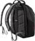 A black rucksack with padded shoulder straps and multiple compartments, suitable for carrying laptops and books.