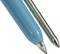 Close-up of a blue ballpoint pen and its refill, showing the tip and metallic barrel.
