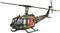 A military helicopter with SAR marking (Search and Rescue) in orange, hovering in the air, green camouflage paintwork, side view.