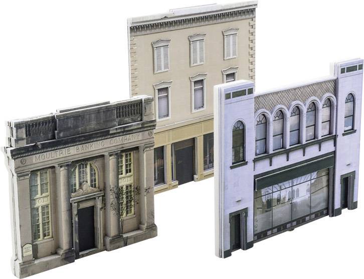 Three detailed miniature models of historical buildings, including a bank with columns, stand upright side by side.