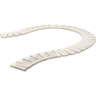 A curved, white stone arrangement in the shape of a question mark.