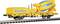 Yellow model construction train with concrete mixer body on a railway track. Text 'TrackConstruction' on the side.