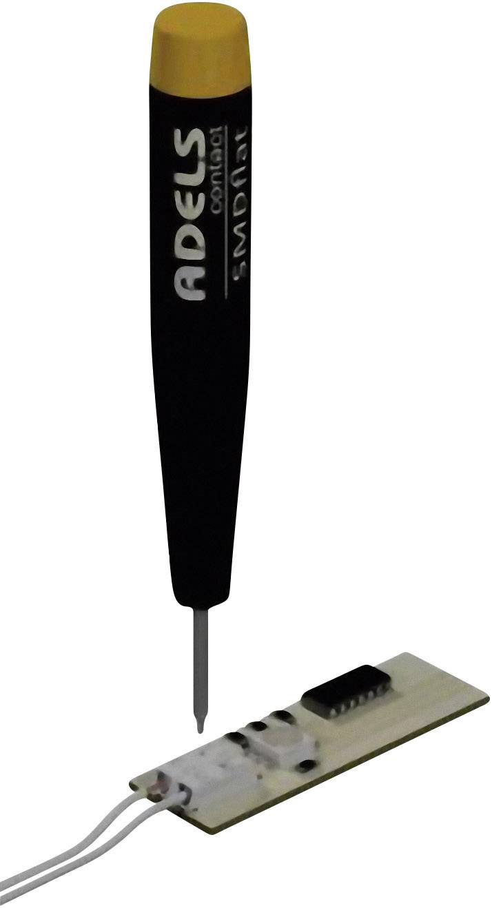 A black pen with a yellow cap from the brand 'Adels Contact', next to a small electronic circuit board with connected wires.