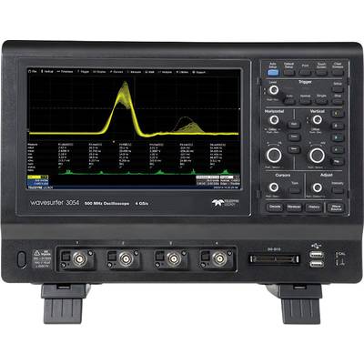 Digital oscilloscope displaying two signal curves. Numerous buttons and connections. Brand logo located in the bottom right of the screen.