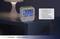 Digital radio alarm clock on bedside table, showing 5:59, Monday. Text beside describes functions: dual alarm, weekday and date.