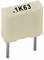Capacitor with '.1K63' marking, two pins, rectangular shape, light beige colour.