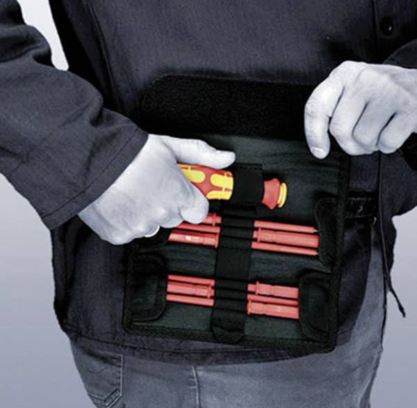A person is holding an open toolbox with several screwdrivers in their hand. The tools are red with yellow handles.