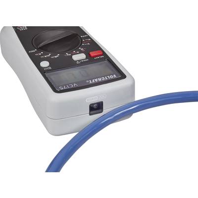 A digital multimeter displays measurements, with a blue cable in the foreground. Specific model: VC175.