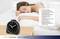 Woman sleeping on a pillow with an alarm clock nearby. Text box describes alarm clock features: high precision, energy-saving function, adjustable alarm.