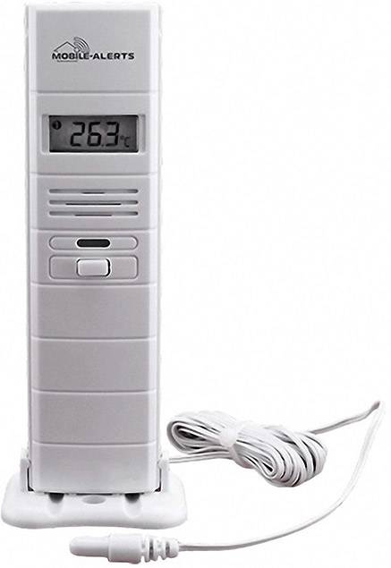 A digital thermometer displays '26.3°C'. It has a white casing and sits on a base. A cable is connected.