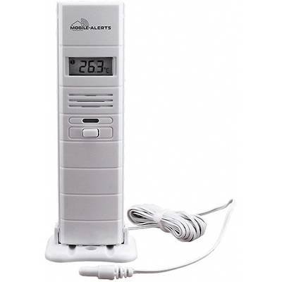 A digital thermometer displays '26.3°C'. It has a white casing and sits on a base. A cable is connected.