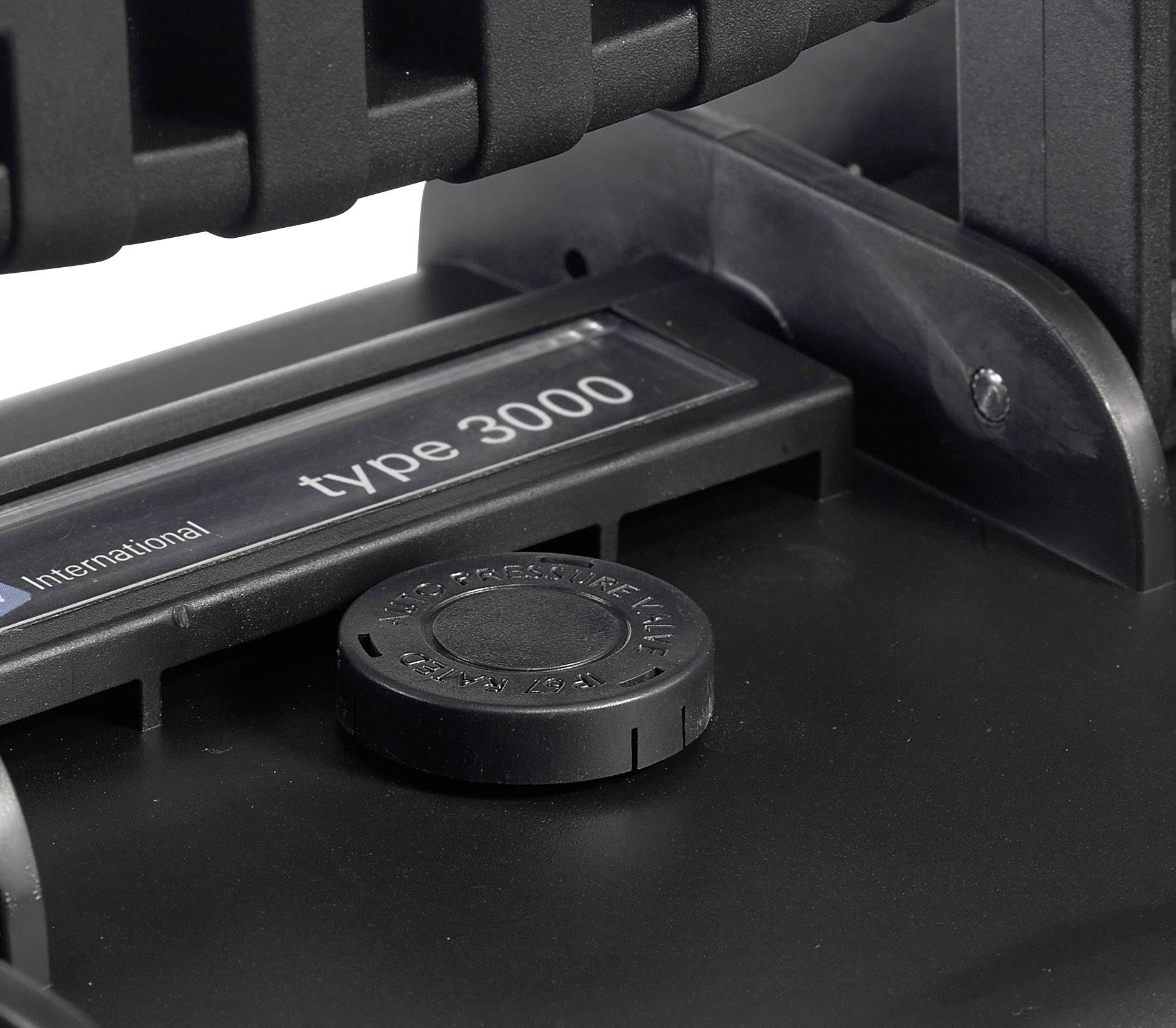 Black and white close-up of a machine component with the label 'type 3000' on its tag.