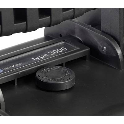 Close-up of a black device with the inscription 'type 3000'. A round control element or button is visible.