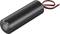 A black, cylindrical electrical capacitor with two protruding cables, one red and one black, against a white background.
