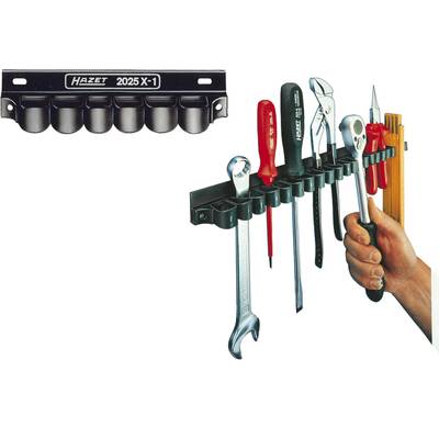 A tool holder with various tools: spanners, screwdrivers and pliers. A hand reaches for the holder.