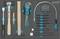 A tool set with a hammer, screwdrivers, Allen keys and chisels in an organised foam insert.