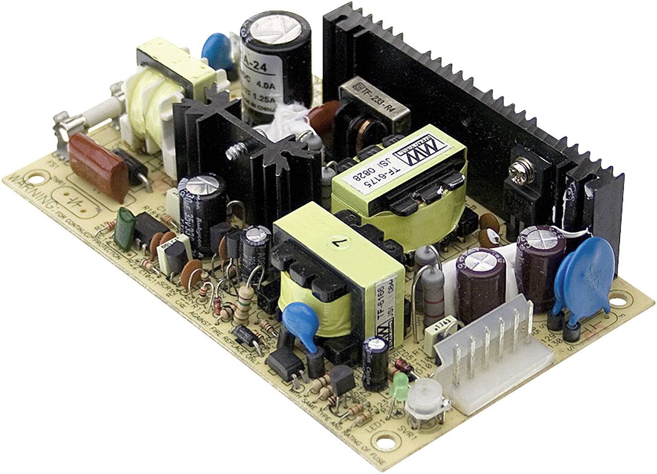 A printed circuit board of a switched-mode power supply with capacitors, resistors, transformers and heatsinks, typically used for electronic devices.