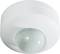 White ceiling motion sensor with a rounded, dome-shaped sensor in the centre.