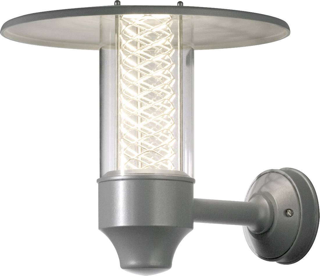 Silver exterior wall light with a modern, cylindrical design and spiral-shaped lamp, emitting soft light.