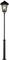 A black lantern with a classic design, glowing in bright light. It stands on a simple, tall pole.