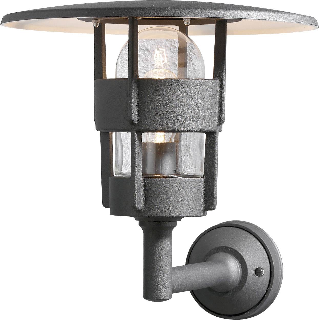 Exterior wall light made of metal, in a dark colour, with a transparent glass housing, mounted on a wall bracket, illuminated.