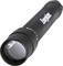 Black Energizer torch with a wide lens and textured grip, resting on a white surface.