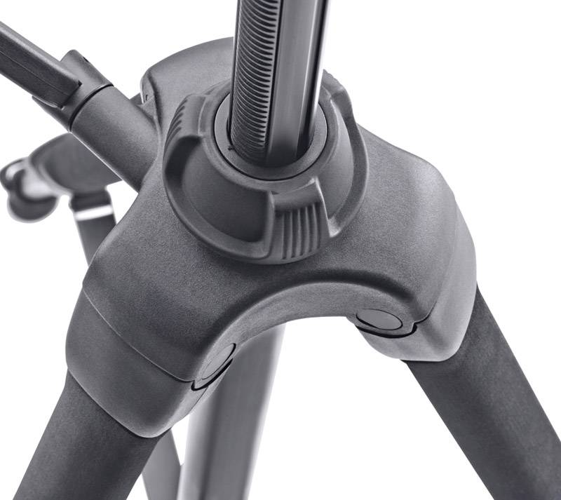 A black tripod with three legs and a central mechanism for height adjustment, shown in close-up.