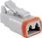 Grey electrical connector with an orange seal, suitable for robust connections in vehicle or industrial machinery.