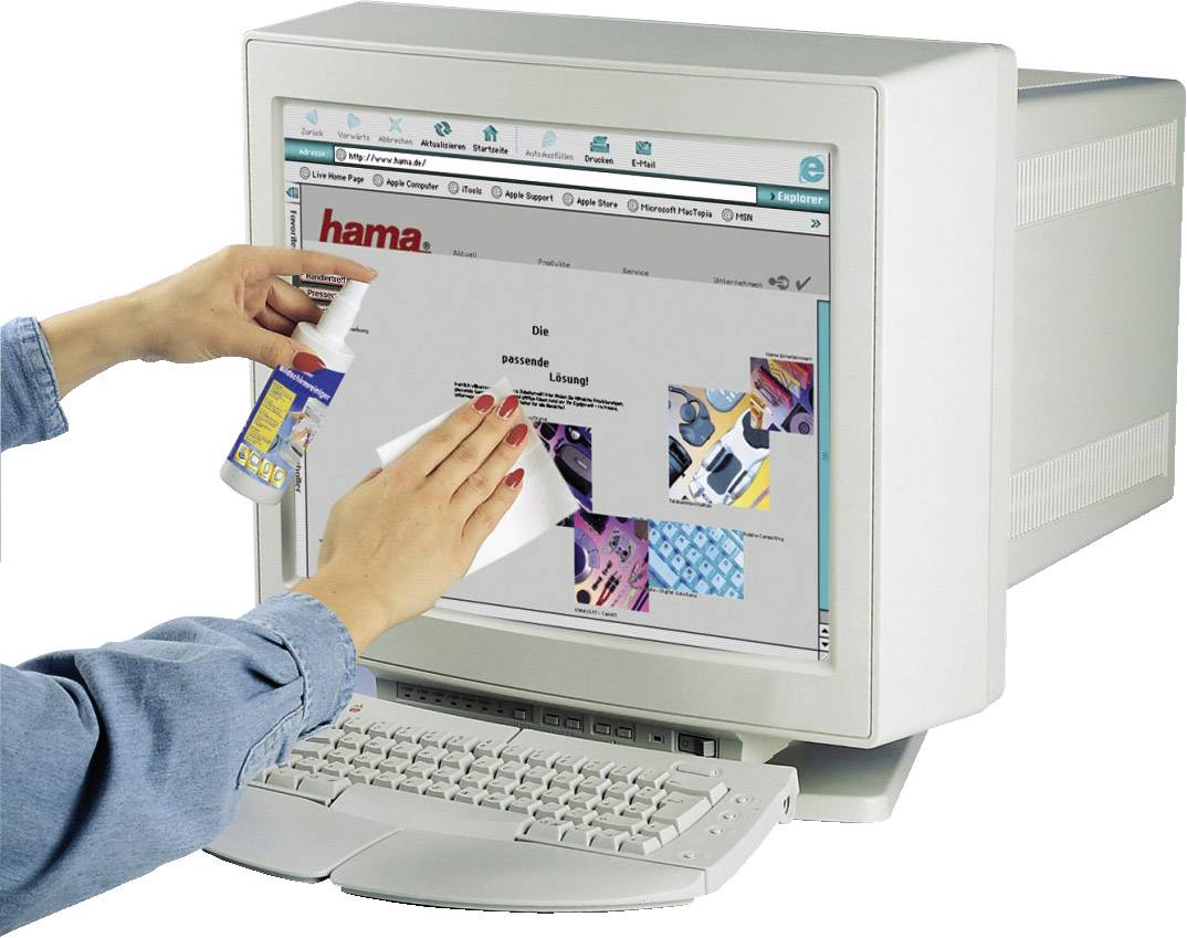 'Person cleaning computer monitor with spray and cloth; a website is open on the screen.'