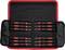 A set of nine screwdrivers with red handles in a fold-out black case with a red trim.
