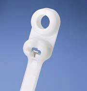 A white plastic component with a circular hole and rectangular cutout against a blue background, potentially a mounting bracket.