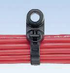 A black cable tie secures a bundle of red cables against a blue background.