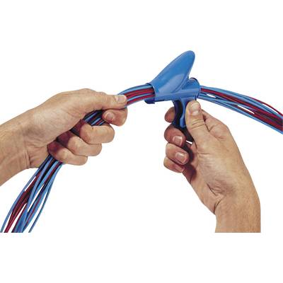 Hands are using a blue tool to bundle several red and blue cables together.
