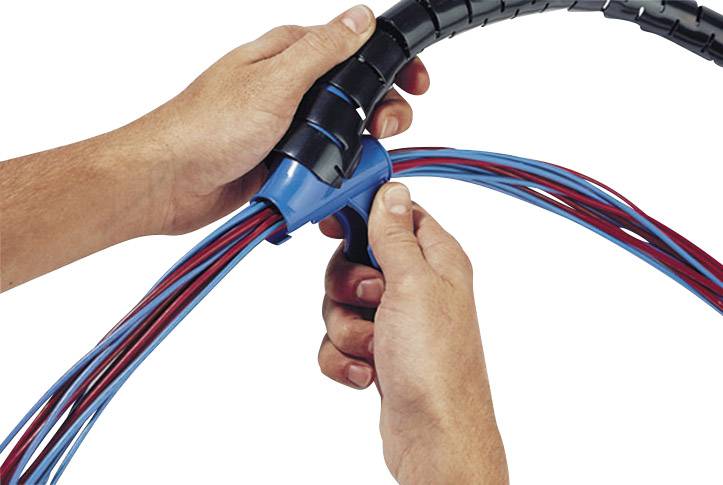 'Two hands are arranging red and blue wires in a black cable sheath.'